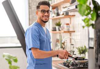 caregiver cooking in the kitchen